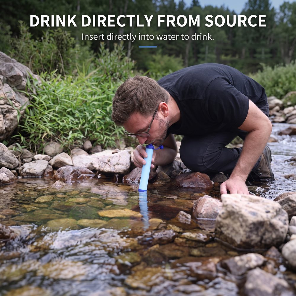 Man drinking from a Clarity Core water filter at a stream