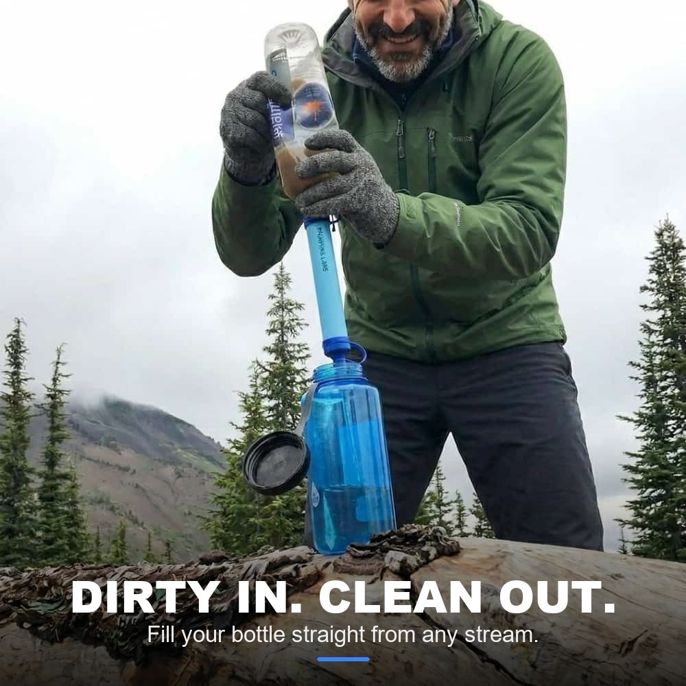Hiker filtering mountain water into a bottle