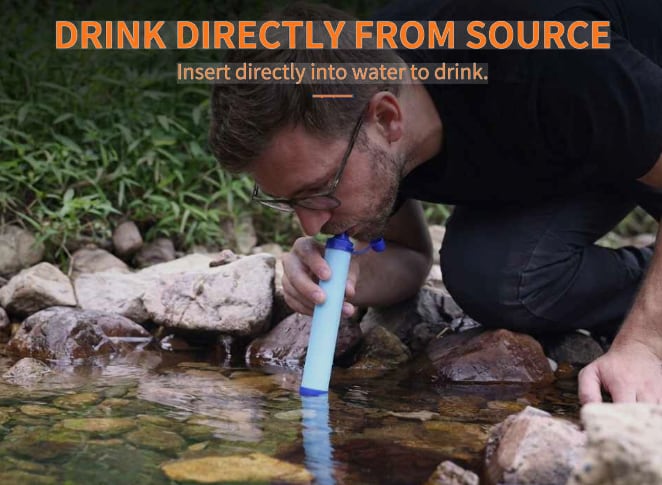 Man drinking directly from a stream through the filter